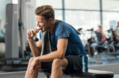 Guy eating protein bar